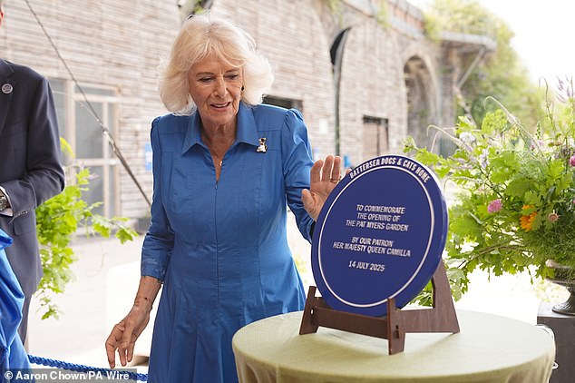 Camilla looked in high spirits as she unveiled a blue plaque which said: 'To commemorate the opening of the Pat Myers Garden by our patron, Her Majesty Queen Camilla'