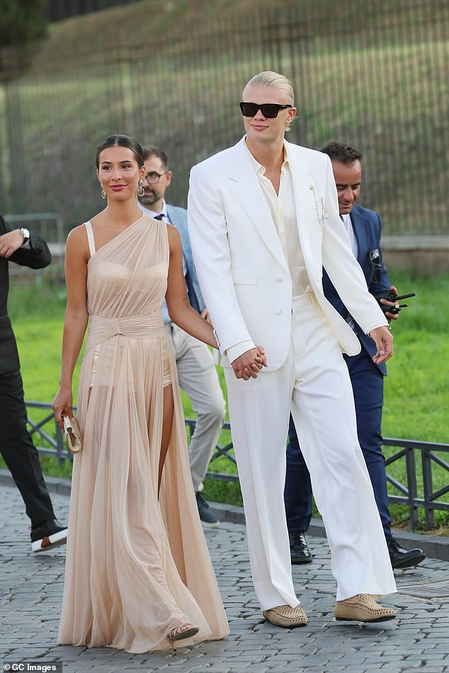 Meanwhile Erling was seen attending the show alongside girlfriend Isabel Haugseng Johansen, the Premier League striker arrived in a tailored white two-piece suit