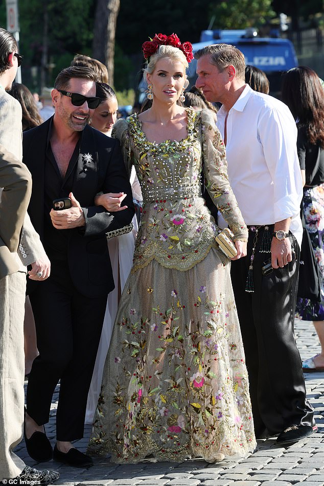 Lady Kitty Spencer turned heads as she arrived in a regal olive dress which featured a colourful floral design
