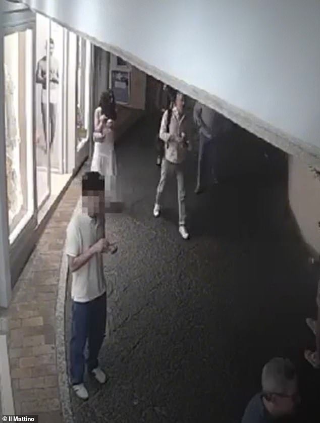 A person who appears to be a baffled Darzi is seen following in disbelief