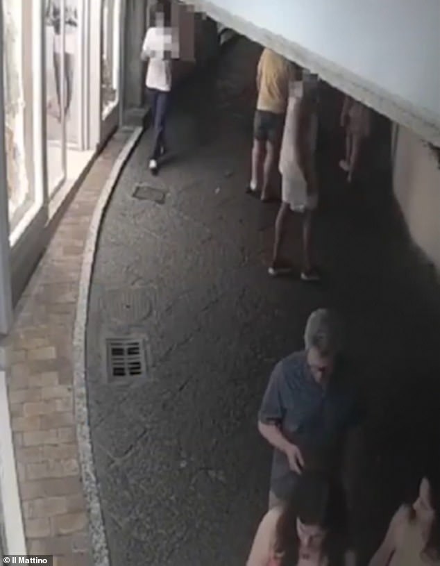 The robber approaches Lord Ara Darzi who had been wearing his £200,000 Richard Mille watch