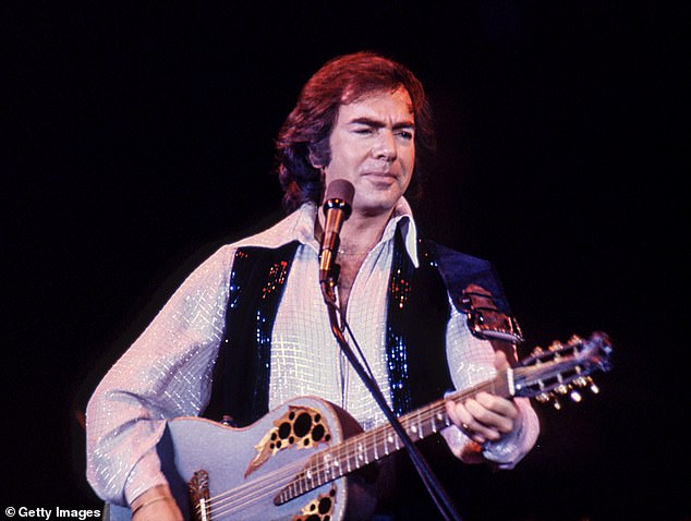 Seven years after retiring from touring following his Parkinson’s disease diagnosis, the beloved music legend, 84, stunned the audience with an impromptu rendition of his 1969 classic, Sweet Caroline, from his seat in the crowd