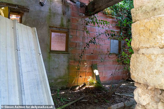 ‘These buildings probably go back to the Middle Ages in some form or other, but it needs someone to spend a proper amount of money restoring all that original brickwork and the oak beams,' another neighbour said