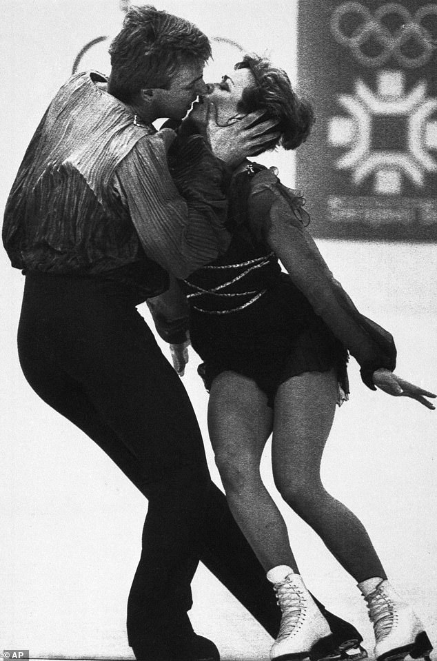 It's clear that the unconventional dynamic between the pair makes for some great ice-skating, as the duo have for decades enjoyed teasing choreography with barely-there pecks and longing looks. Pictured at the Olympics in 1984