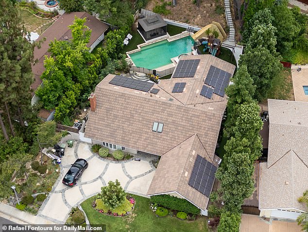 Mei's parents moved into the couple's sprawling home (pictured) to help raise their three sons