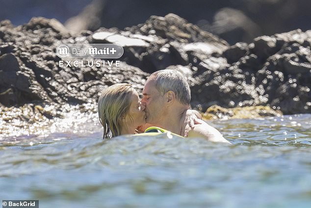 The pair were seen kissing during their swim