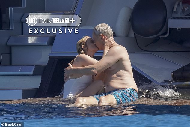 Witherspoon looked smitten with the handsome financier