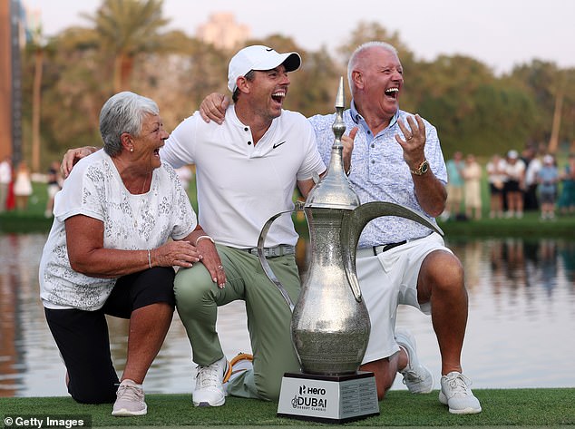 Rory with his parents Rosie and Gerry after winning the Dubai Desert Classic last year