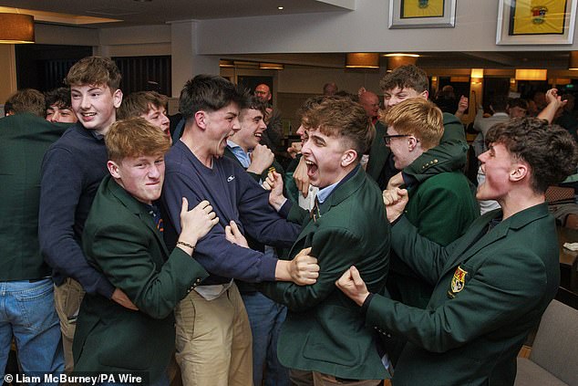 The club's members erupt in joy after McIlroy won the Masters in April, completing the career Grand Slam