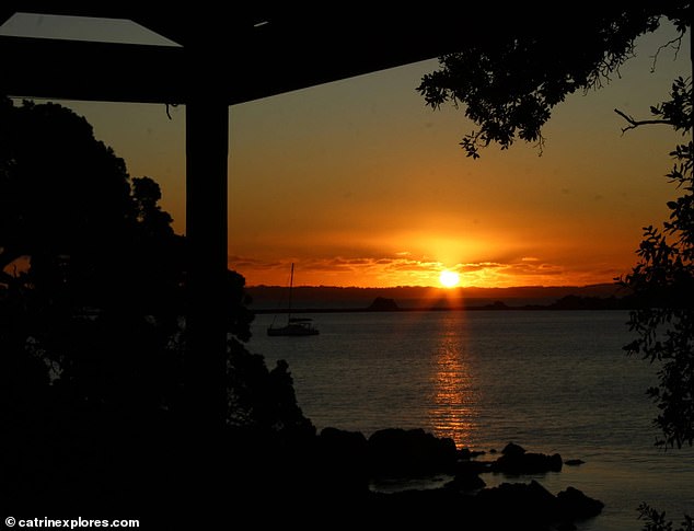 It's known for its tranquil environment, offering walking tracks, coastal views, and opportunities to explore both Maori and World War II history (Pictured: Catrin's photo of a sunset on Motutapu Island)