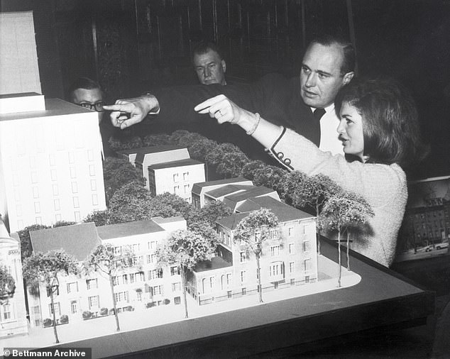 Jackie not only corrected Meyer on the name of the park, she also coolly handed her an empty champagne glass when Meyer extended her hand to say goodbye (PICTURED: Jackie looking at her design for restoring Lafayette Square)
