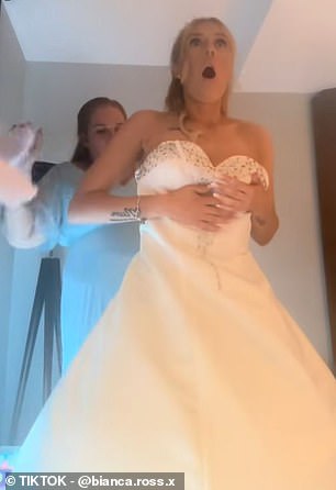 Bianca was being helped by two of her bridesmaids to get into her corseted wedding dress before they heard a large rip