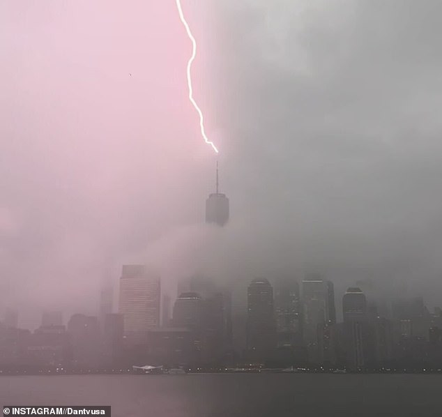 Huge swathes of New York City were warned to brace for flash floods as thunderstorms wreak havoc on the region. Pictured: Photographer Dan Martland captured lightning hitting the World Trade Center on Monday