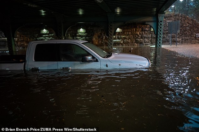 A pick up truck is underwater from a flash flood in Plainfield, New Jersey. A city Emergency was called by city officials