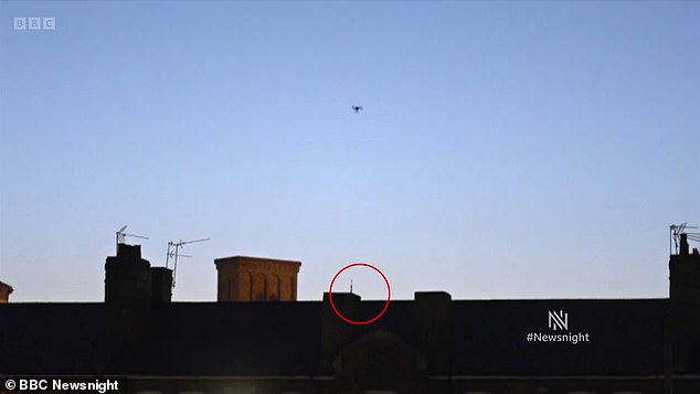 The item (circled) vanished behind the walls of the prison and out of view, sparking fears over what it may contain