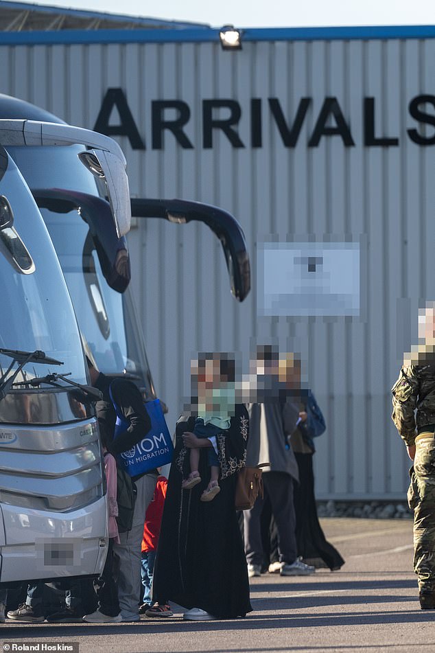 The Afghans were flown in from Pakistan and then processed before being whisked off by coach to start a new life in Britain
