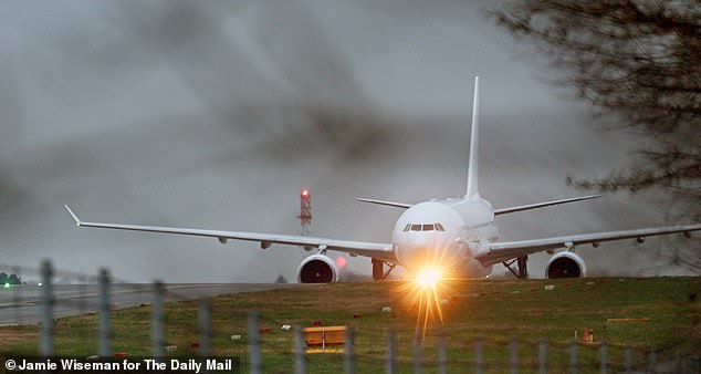 One of the Government's unmarked planes arriving at Stansted Airport in Essex with 227 Afghans on board