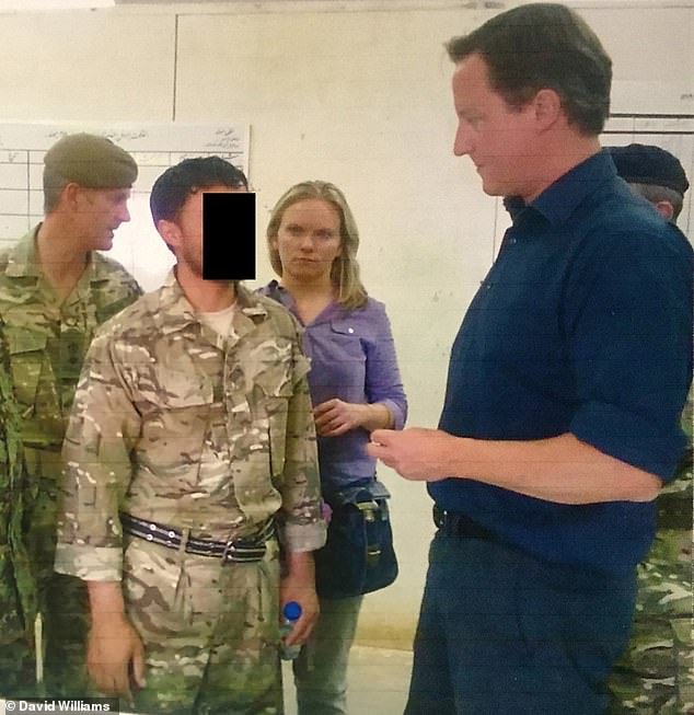Afghan interpreter Shaffy with David Cameron during the Prime Minister's 2011 trip to Afghanistan. Hundreds of loyal interpreters face being hunted down as traitors by the Taliban