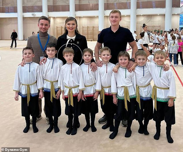 Putin's alleged secret son, circled, has been spotted in photographs with his team mates
