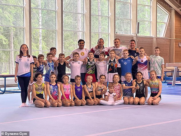Although the boy, circled, appears in several pictures with his teammates, it has been alleged that he does not travel with them
