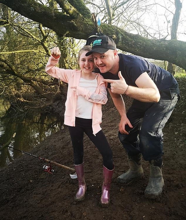 Stuart with his daughter Courtney, who was hauled from lessons due to her outfit