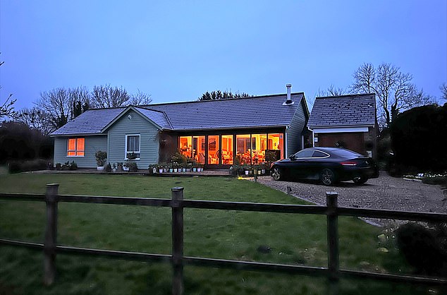 She was often away from her £550,000 detached bungalow in a picturesque Wiltshire hamlet (pictured), stealing from shops across the country