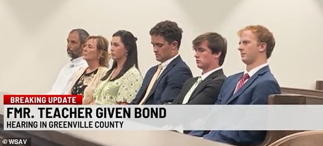Her family, including her fiancé, are seen supporting her in court Monday