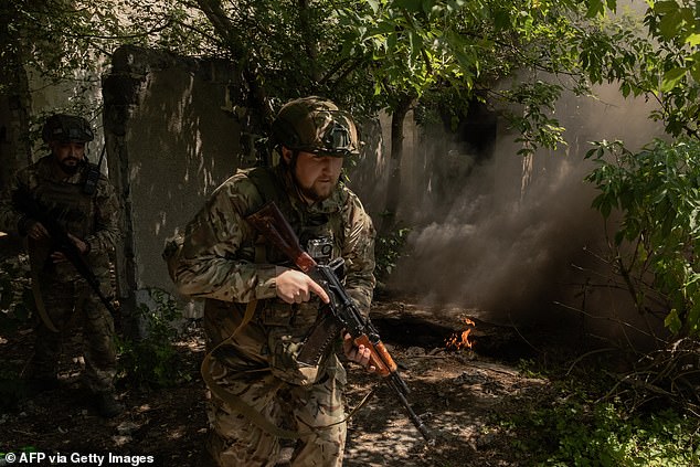 Ukrainian servicemen of the Spartan Brigade take part in a combined mental resilience and combat training exercise in Dnipropetrovsk region