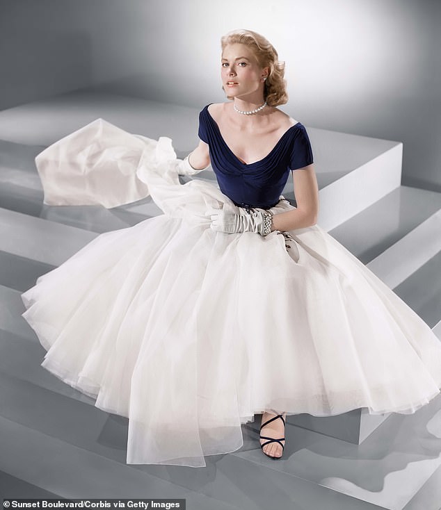 The original design — a romantic navy dress with a dramatic portrait neckline and voluminous white skirt — was the work of legendary Hollywood costume designer Edith Head