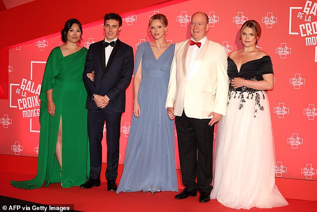 Son of Stephanie of Monaco, Louis Ducruet (2nd L) and his wife Marie Chevallier (L), Prince Albert II of Monaco (2R), Princess Charlene of Monaco (C) and Daughter of Stephanie of Monaco, Camille Gottlieb pose as they arrive to attend the 76th annual Monaco Red Cross Ball
