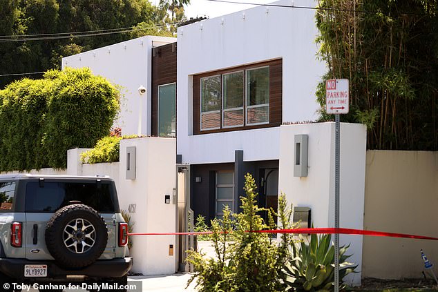 According to neighbors, a person, who may have been armed, was spotted hopping a fence on the tree-lined street in the ritzy California neighborhood