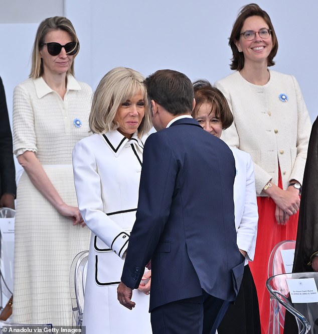 French President Emmanuel Macron (R) and his wife Brigitte Macron attend the annual Bastille Day military parade day on Concorde in Paris, France on July 14, 2025