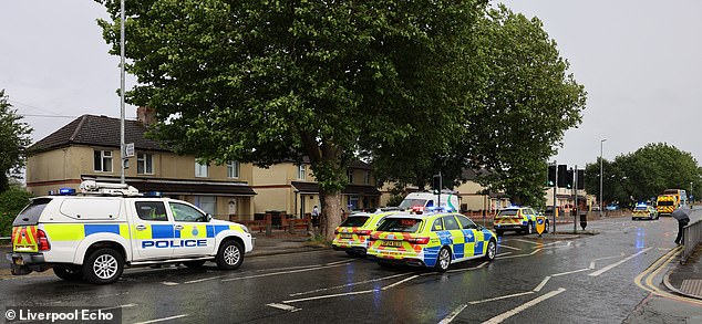 Swarms of cops were called to the busy road and set up a wide cordon tape from the junction of Woodward Road to the junction of Dell Grove