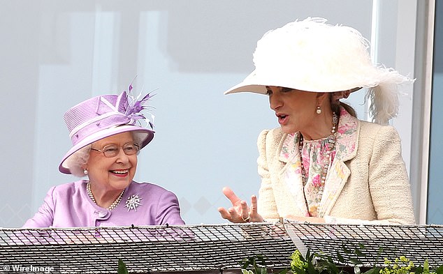 Queen Elizabeth II and Princess Michael of Kent watch the racing on Derby day at the Investec Derby Festival at Epsom Racecourse on June 7, 2014