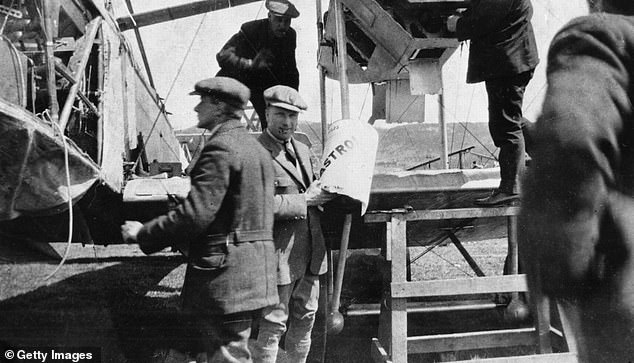 Alcock and Brown pictured next to their aircraft