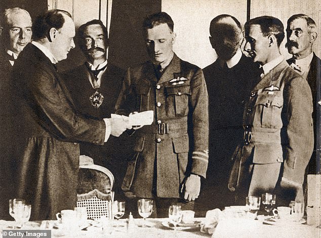 Alcock and Brown seen being presented with their £10,000 prize by Winston Churchill