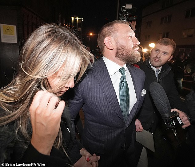 While many likely would have left behind the UFC fighter, 37, years ago, his fiancée has stood by him amid a myriad of scandals - making her support clear through social media posts. Pictured with McGregor in November, leaving the High Court in Dublin after the personal injury case against him