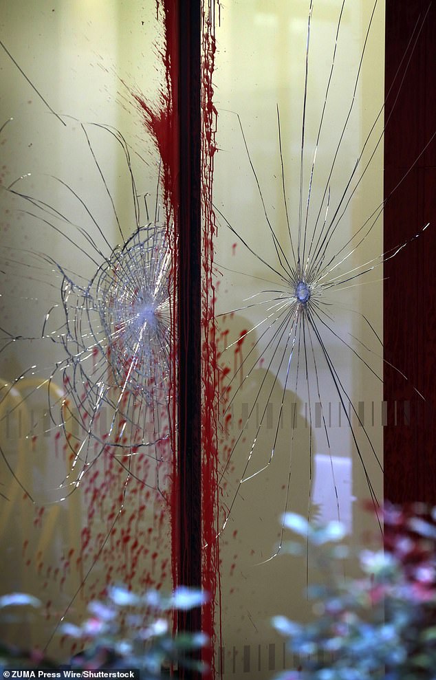 The windows of Leonardo's office are smashed after an attack by pro-Palestine activists on June 10