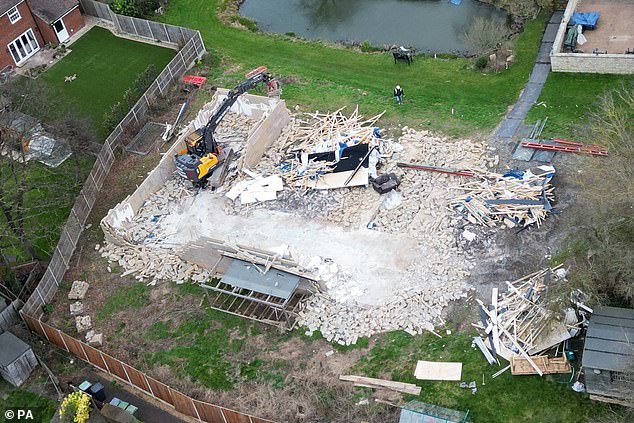 Experts tearing down walls of the spa complex at Mrs Ingram-Moore's home