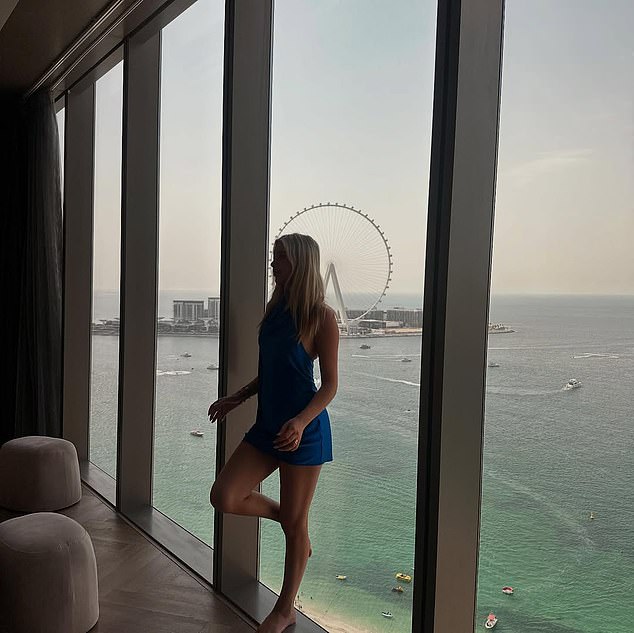 Phoebe posing in front of the Dubai Eye, the world's tallest observation wheel