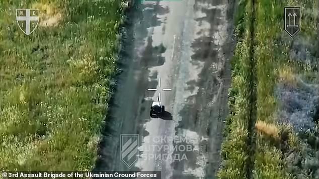 As the first drone - reportedly carrying an anti-tank mine - detonated, the Russian soldiers realised the imminent danger and quickly created a cardboard sign to signal their surrender before a second drone could strike