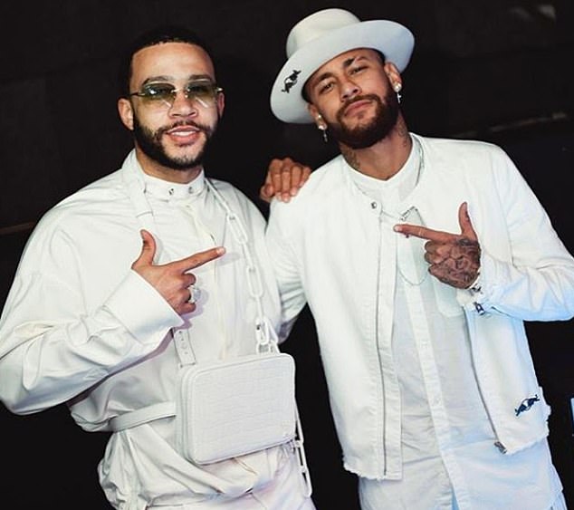 The Brazilian poses with Lyon forward Memphis Depay during the bash at YoYo club in Paris