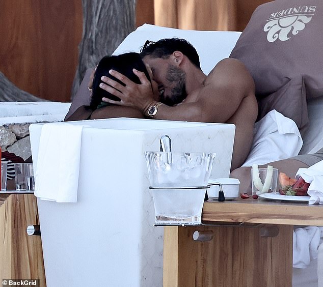 As Maya and Ruben reclined on a sunbed together, the couple were quick to pack on the PDA as they shared a kiss