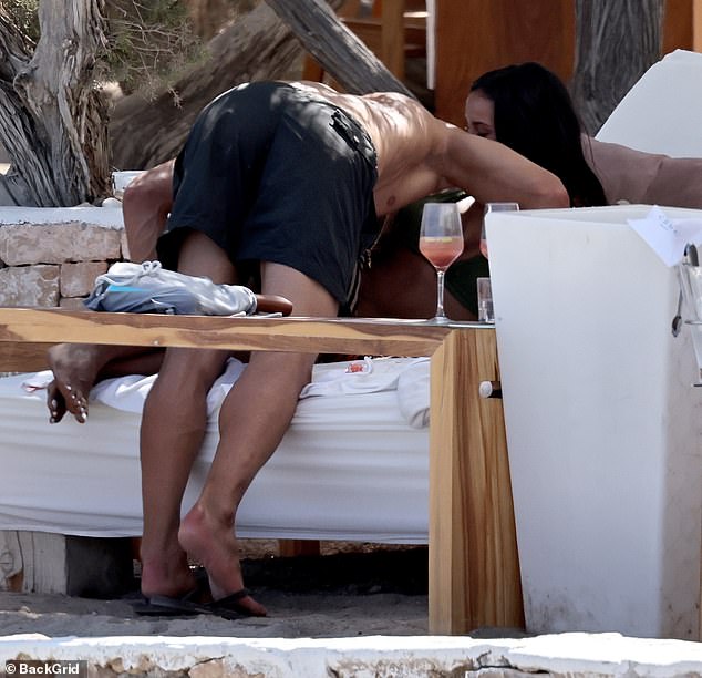 The couple put on an amorous display as they soaked up the sunshine together