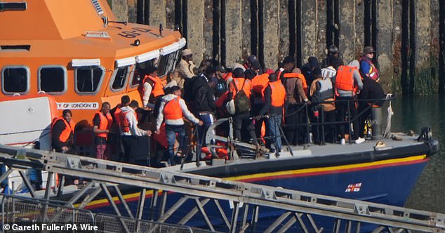 A group of people thought to be migrants are brought in to Dover, Kent, onboard an RNLI Lifeboat following a small boat incident in the Channel. Picture date: Thursday July 10, 202