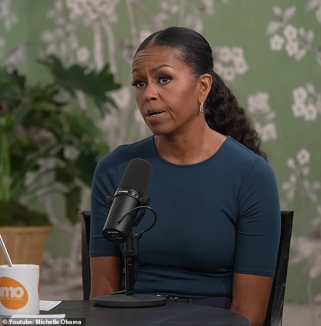 'As Barack arrives to take his seat, Michelle rubs her hands on her thighs in what looks like a self-calming ritual before placing her hands below the desk, between her legs,' Judi exclusively told the Daily Mail