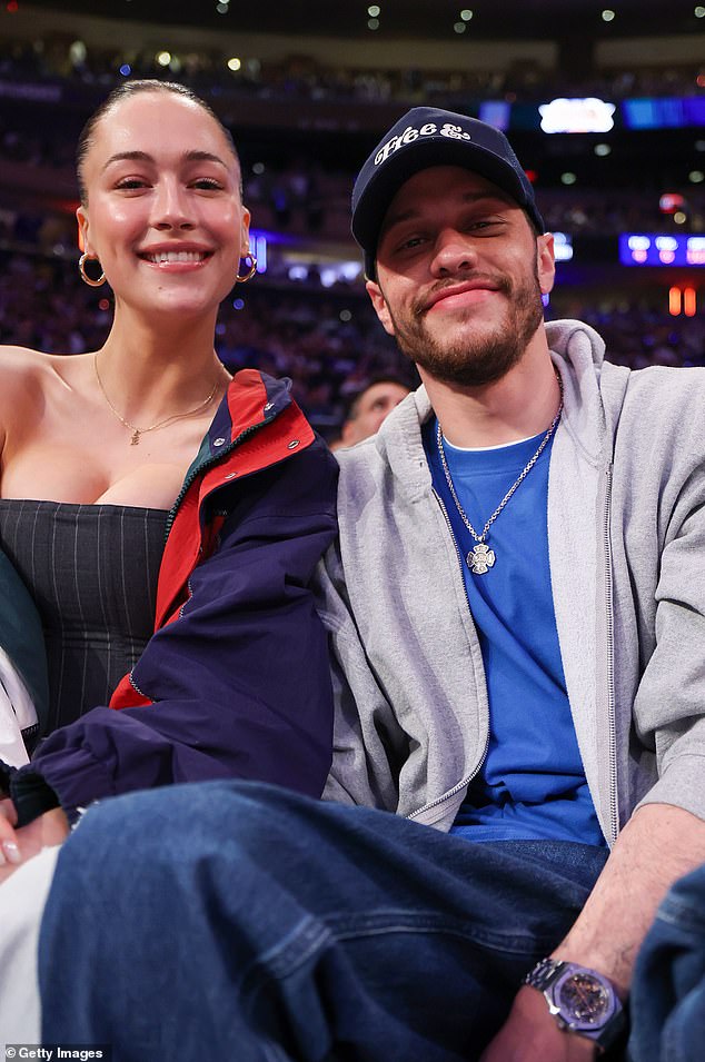 News of their romance emerged in March, with insiders describing Hewitt as a 'non-celebrity' and unlike 'anybody else [Davidson's] ever dated'; the couple seen in May