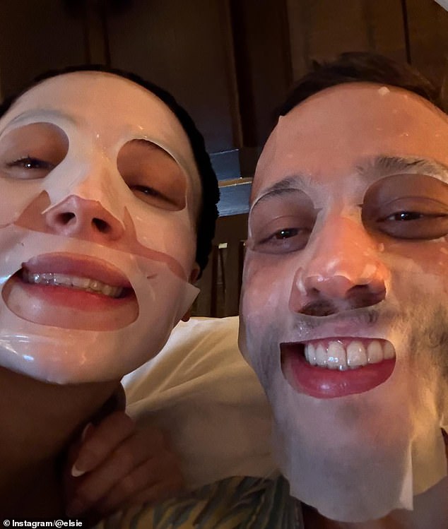 The couple posed with face masks in another snap
