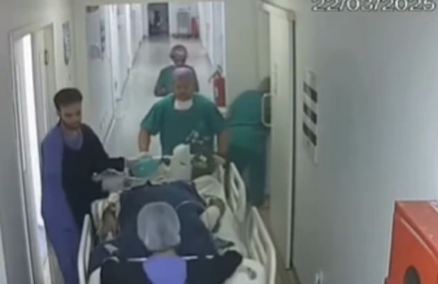 Pictured: Bonotto on the gurney was the hospital staff transported him to the operating room while Dr. de Mello followed them as she deleted messages and a video from his phone