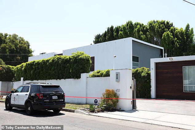 On Monday night, a suspect was spotted hopping a fence to enter the home (pictured) of an American Idol music executive and her husband in the ritzy California neighborhood of Encino